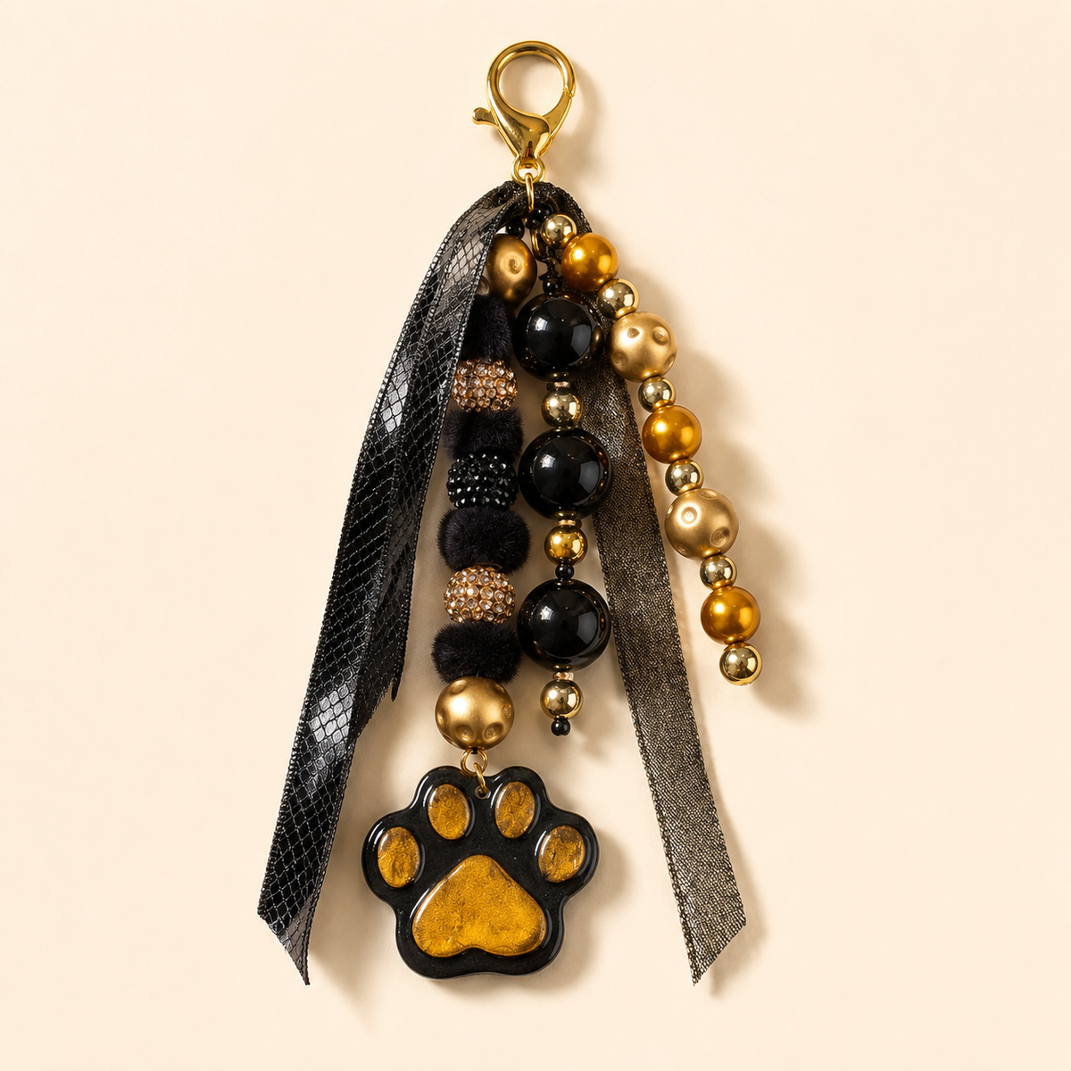 Black & Gold Paw Print Bag Charm | Yes, And…