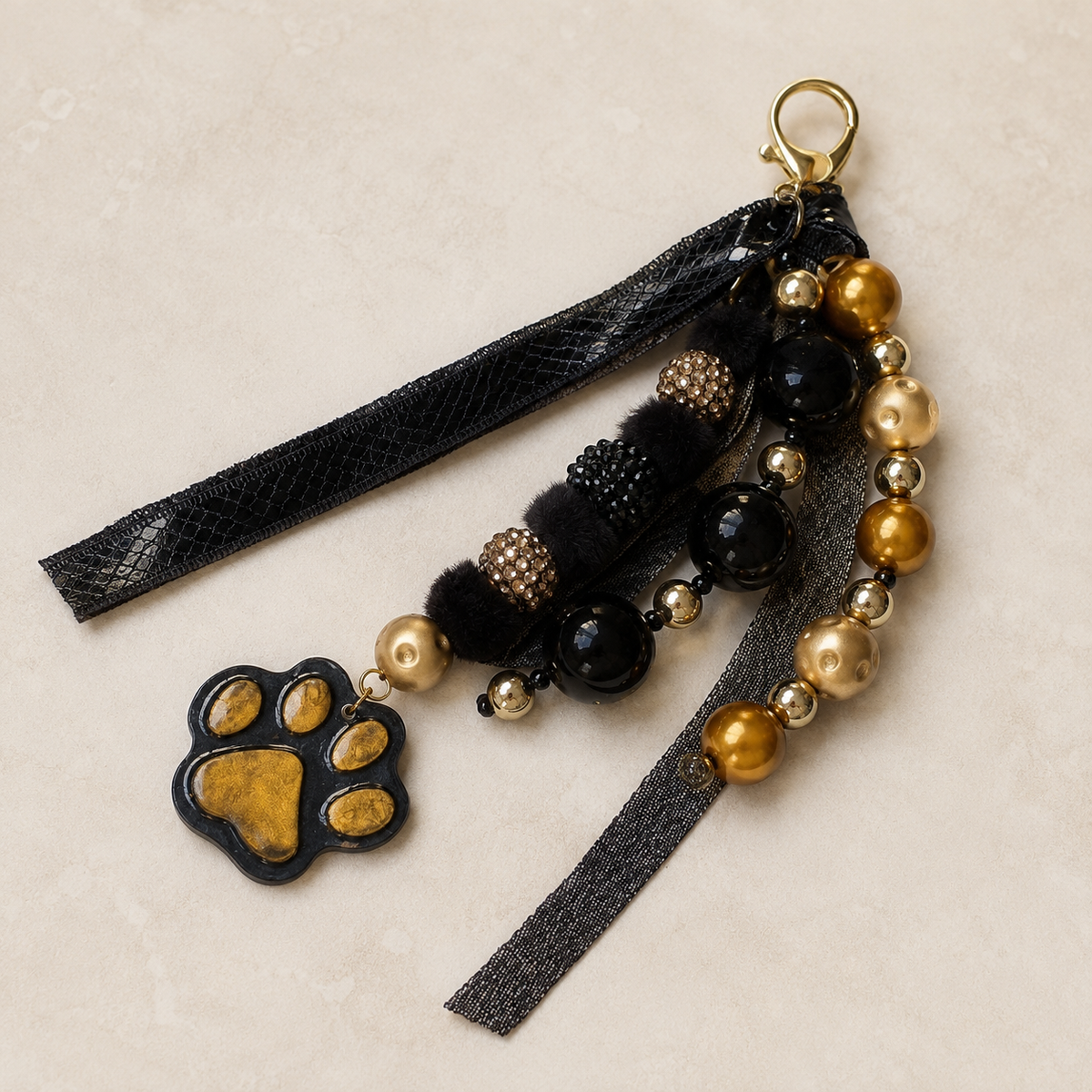 Black & Gold Paw Print Bag Charm | Yes, And…